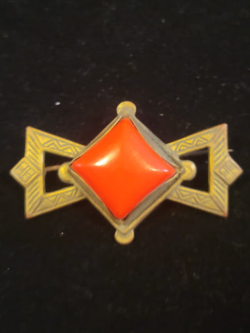 bronze and orange tone brooch