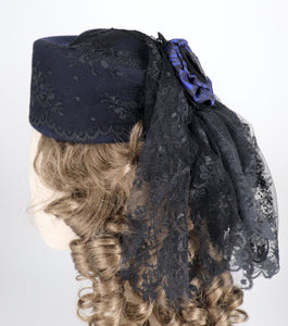 bustle hat in black and blue